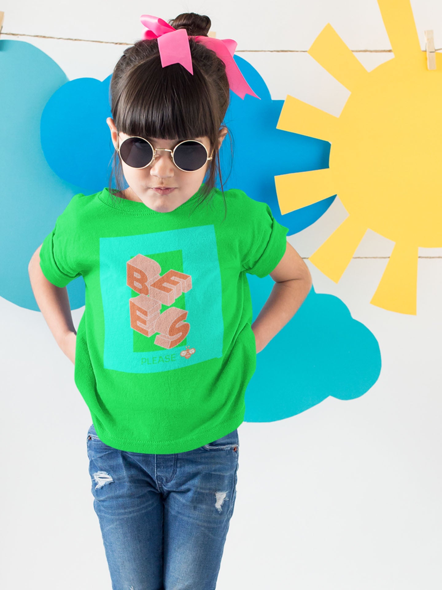 little girl wearing sunglasses and green tshirt with bees please graphic design