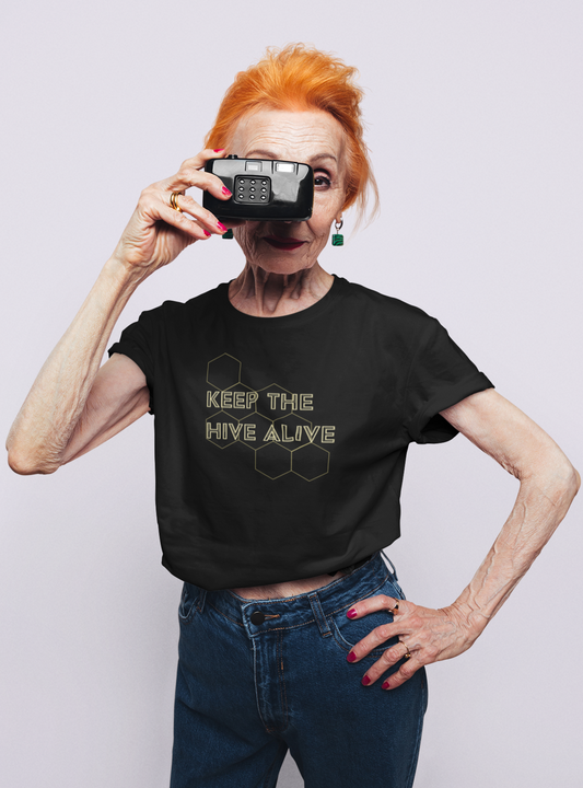 model holding camera wearing black tshirt with keep the hive alive graphic design
